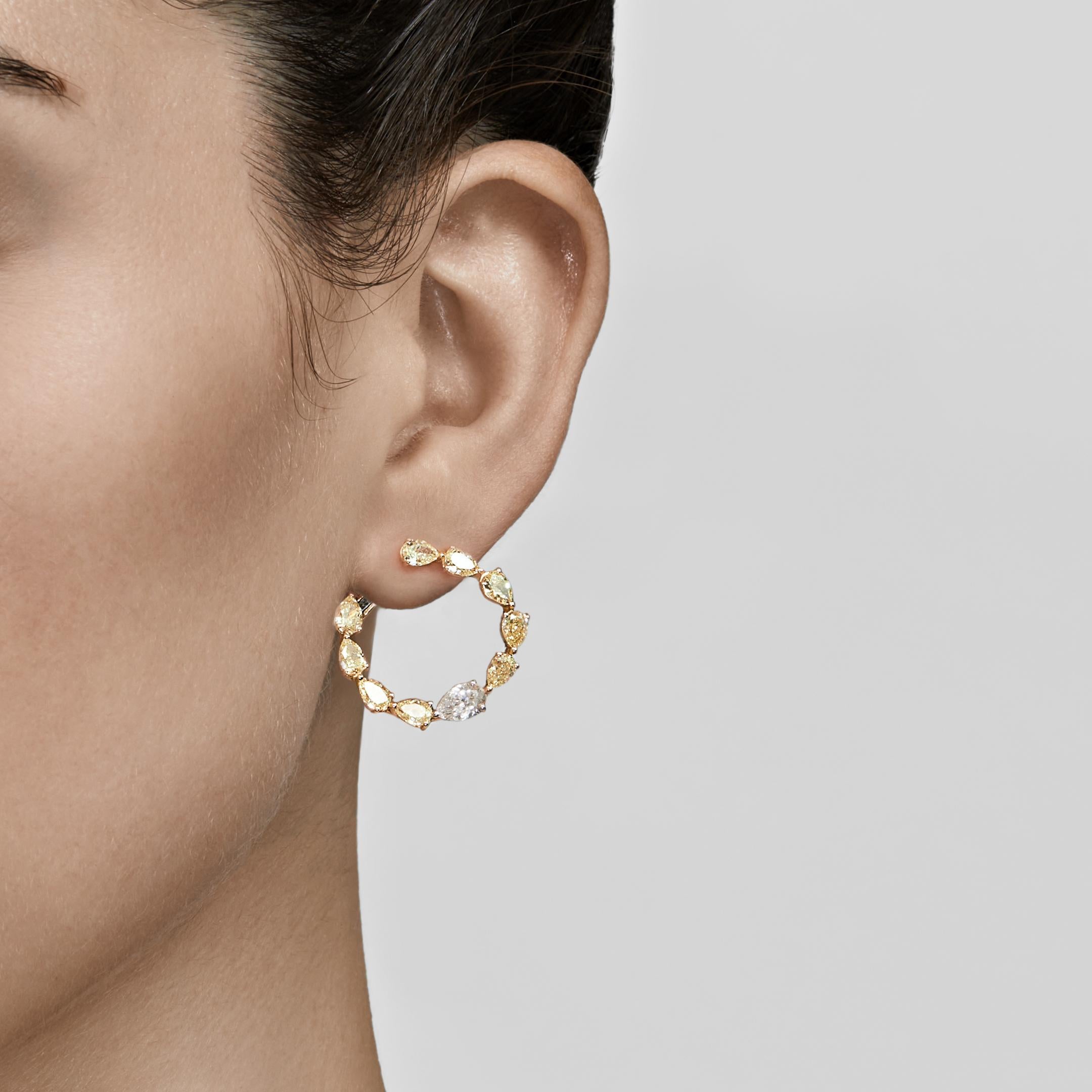 Hoop earrings are a fine jewelry necessity that works for so many occasions. Small huggie hoop lend polish to a humble errand run, while a large, luxurious pair becomes the focal point of your ensemble. These pear-shaped yellow and white diamond