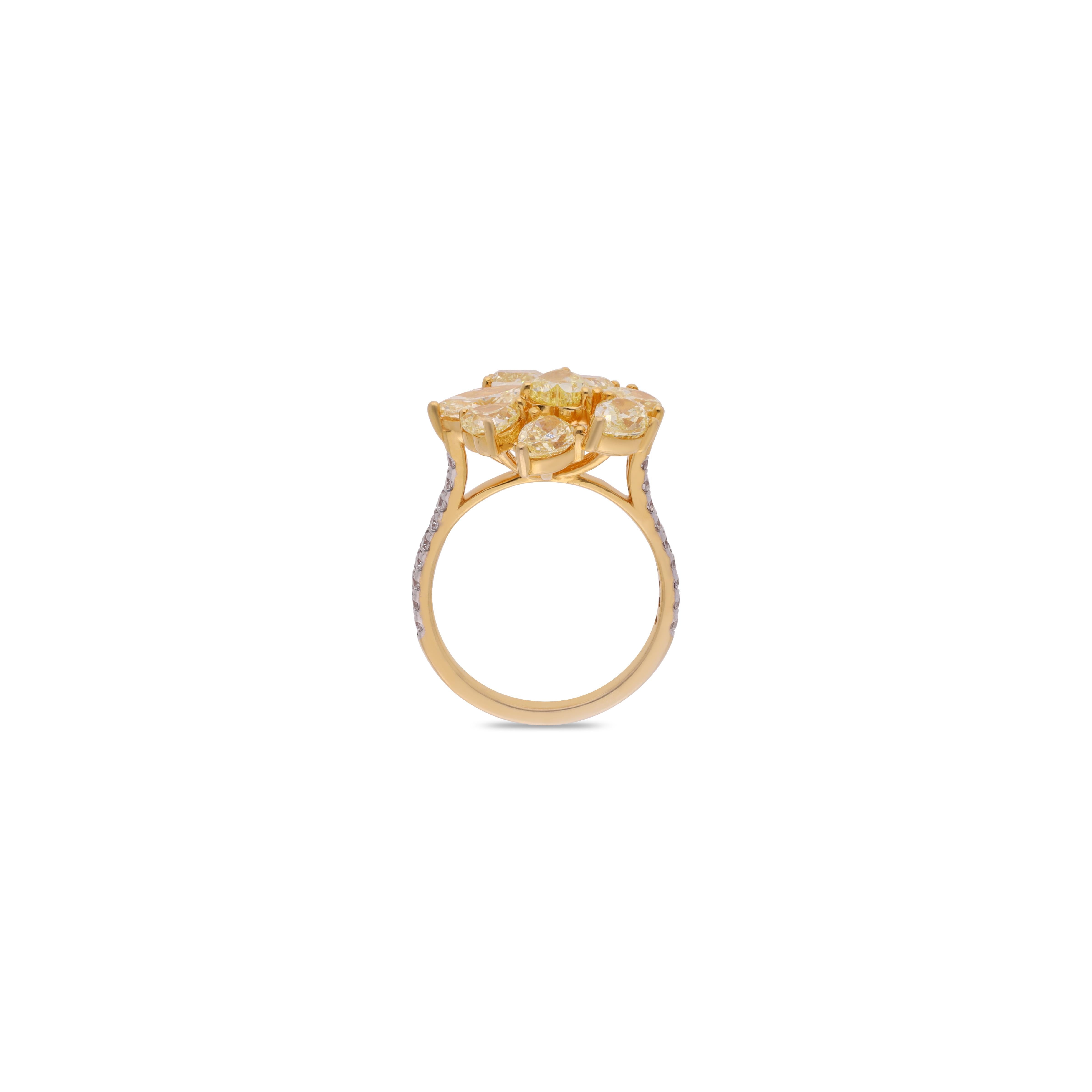 Yellow diamonds with white diamonds on the band create a stunning, radiant design. The vibrant yellow diamonds add a touch of warmth and luxury, while the white diamonds on the band enhance the overall sparkle and elegance. This perfect balance of