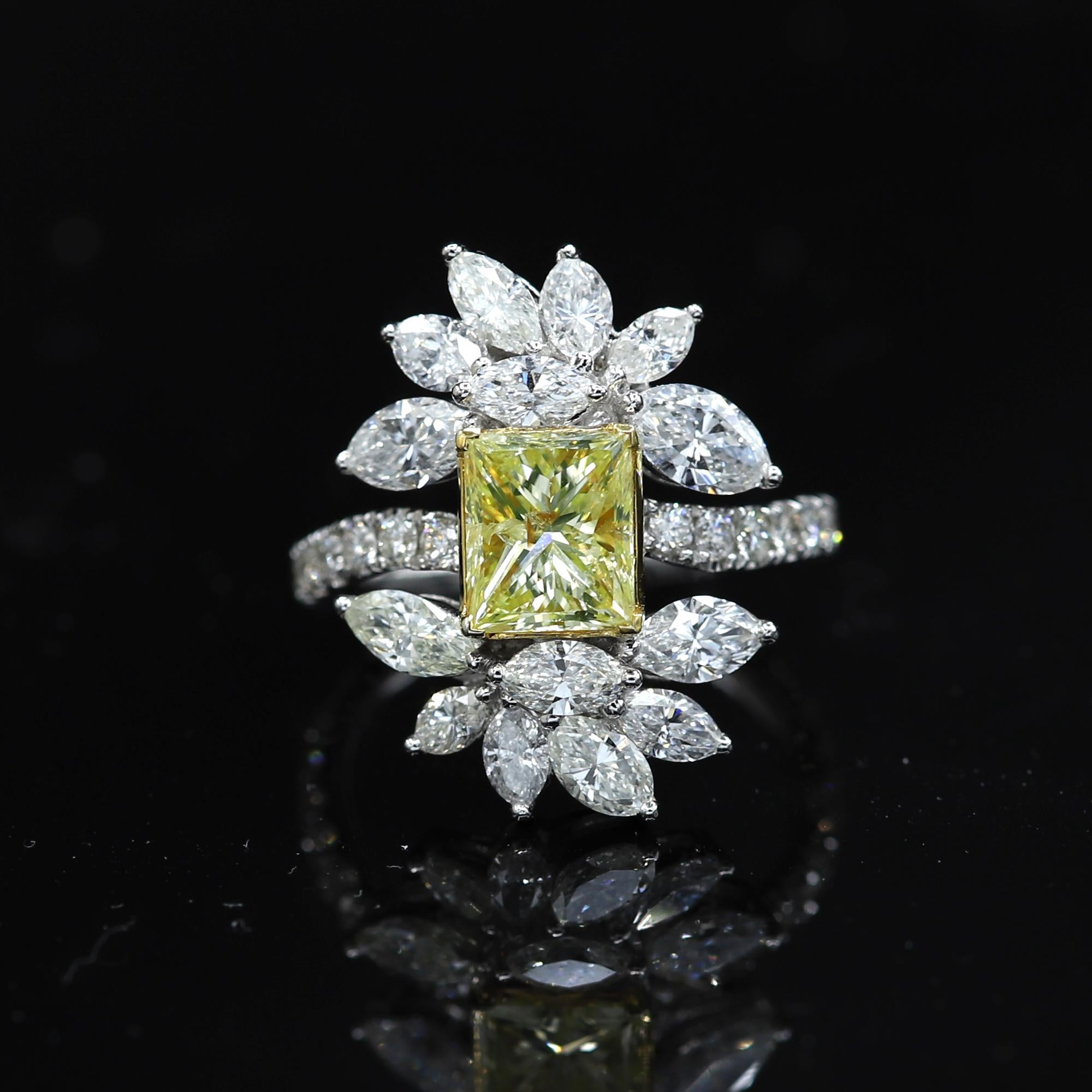 Unique and Brilliant Design and artistic craftsman, Statement Ring. Yellow & White Diamonds- all natural stones.
18k White Gold 8.0 grams, Center Stone is Natural Light Yellow - I1-I2, 1.91 carat.  All other Diamonds (marquise & small round) total
