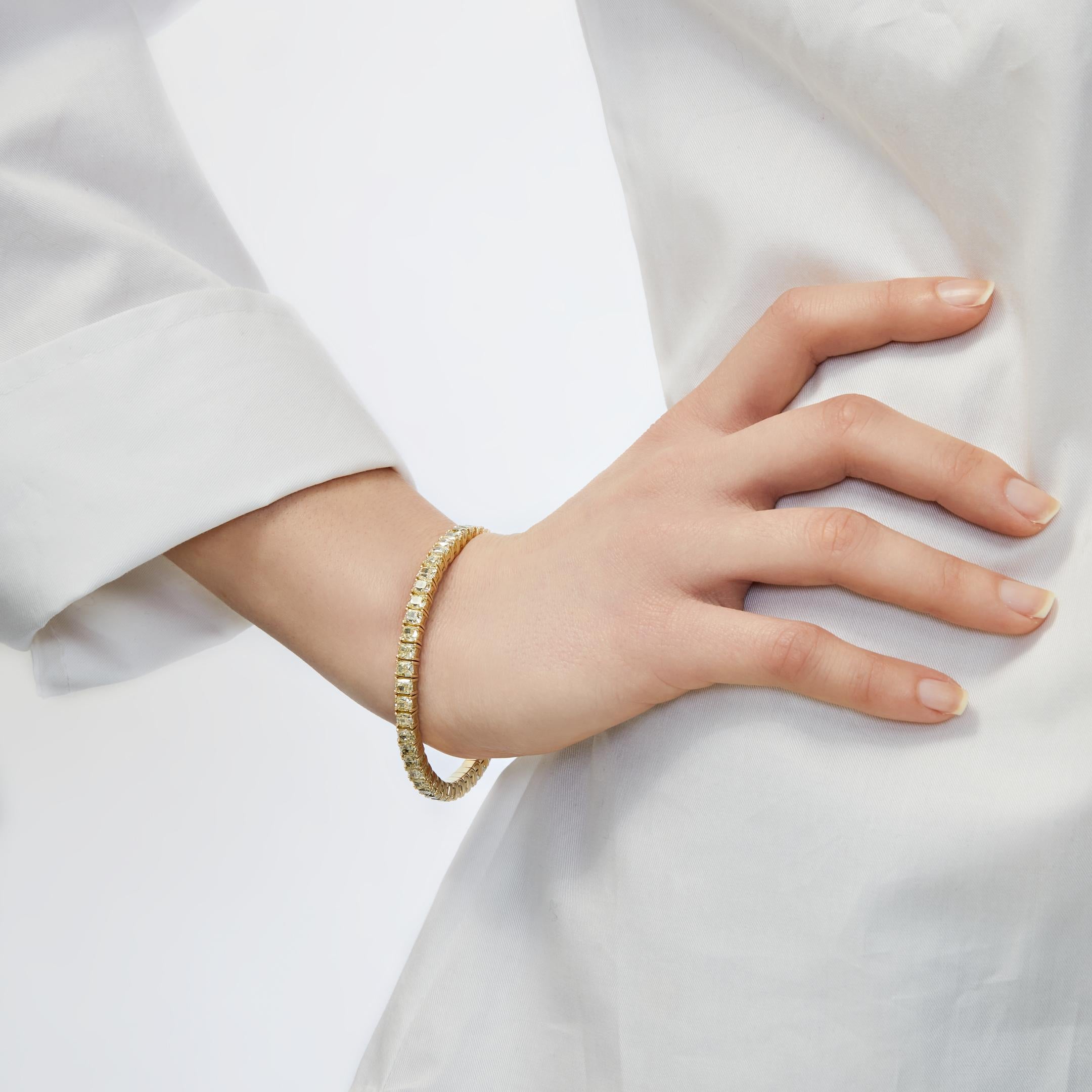 Experience the opulence of spectacular yellow diamonds in this tennis bracelet that is the embodiment of luxury. A row of striking cushion-cut yellow diamonds is set in 18-karat yellow gold for a perfect monochrome look. The best part? The yellow