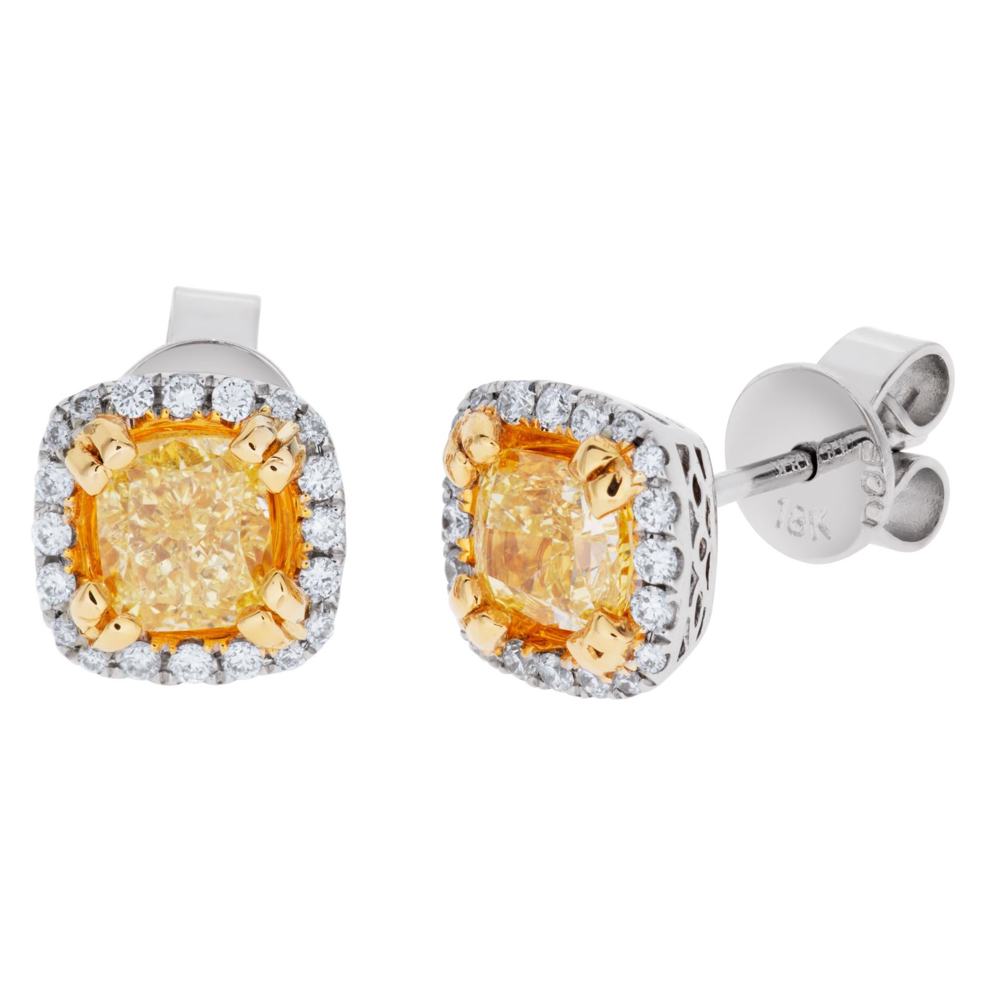 Yellow diamond stud earrings in 18k white and yellow gold, approximately 0.16 carat in white diamonds and 1.05 carats in yellow diamonds. Size 7.4mm x 7.4mm.
