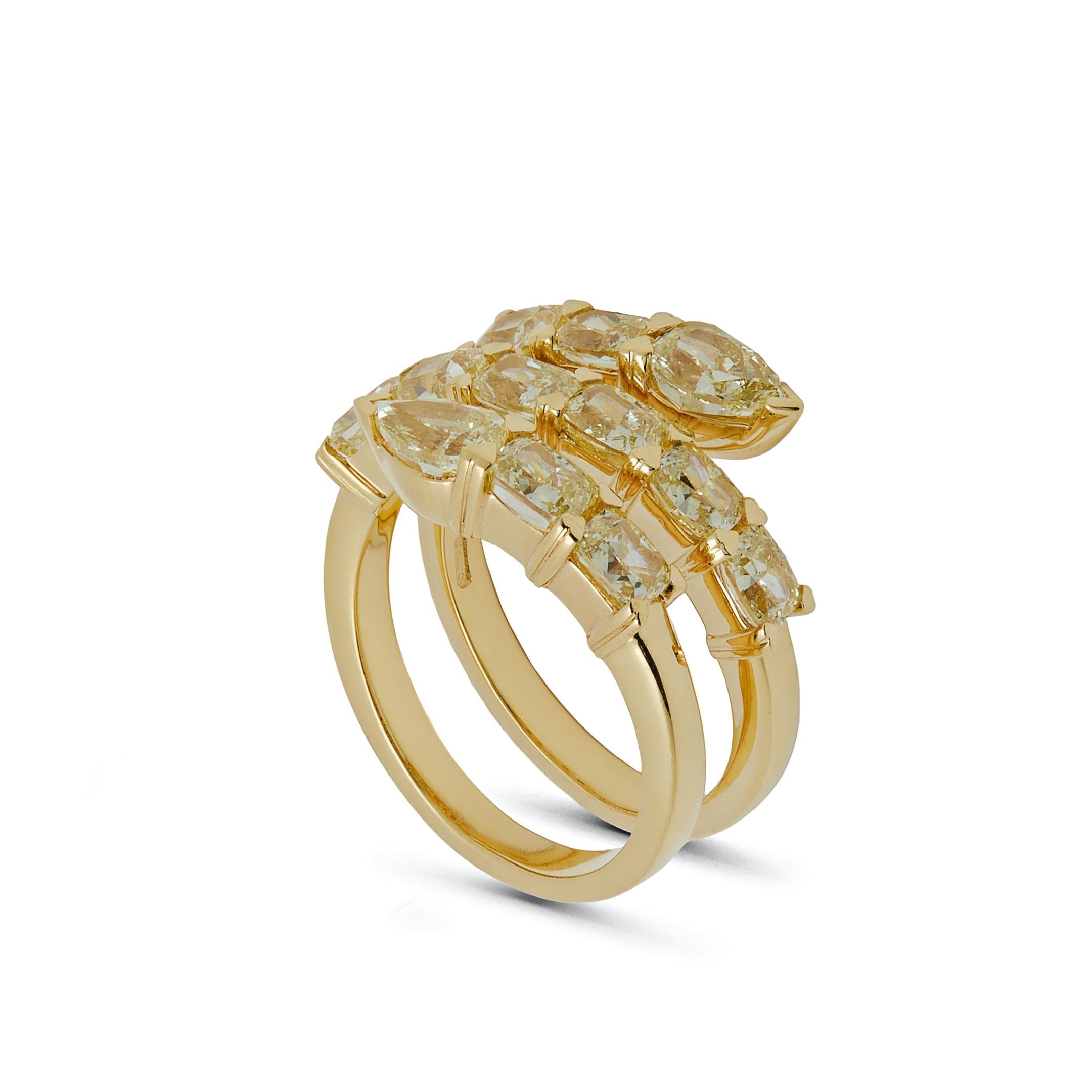 Three rows of shining gems comprise the exuberant Yellow Diamond Twist Ring. Stunning pear-shaped and oval-cut yellow diamonds are expertly matched with warm 18-karat yellow gold. Wear your ring with denim, heels and your favorite Hermés bag for the
