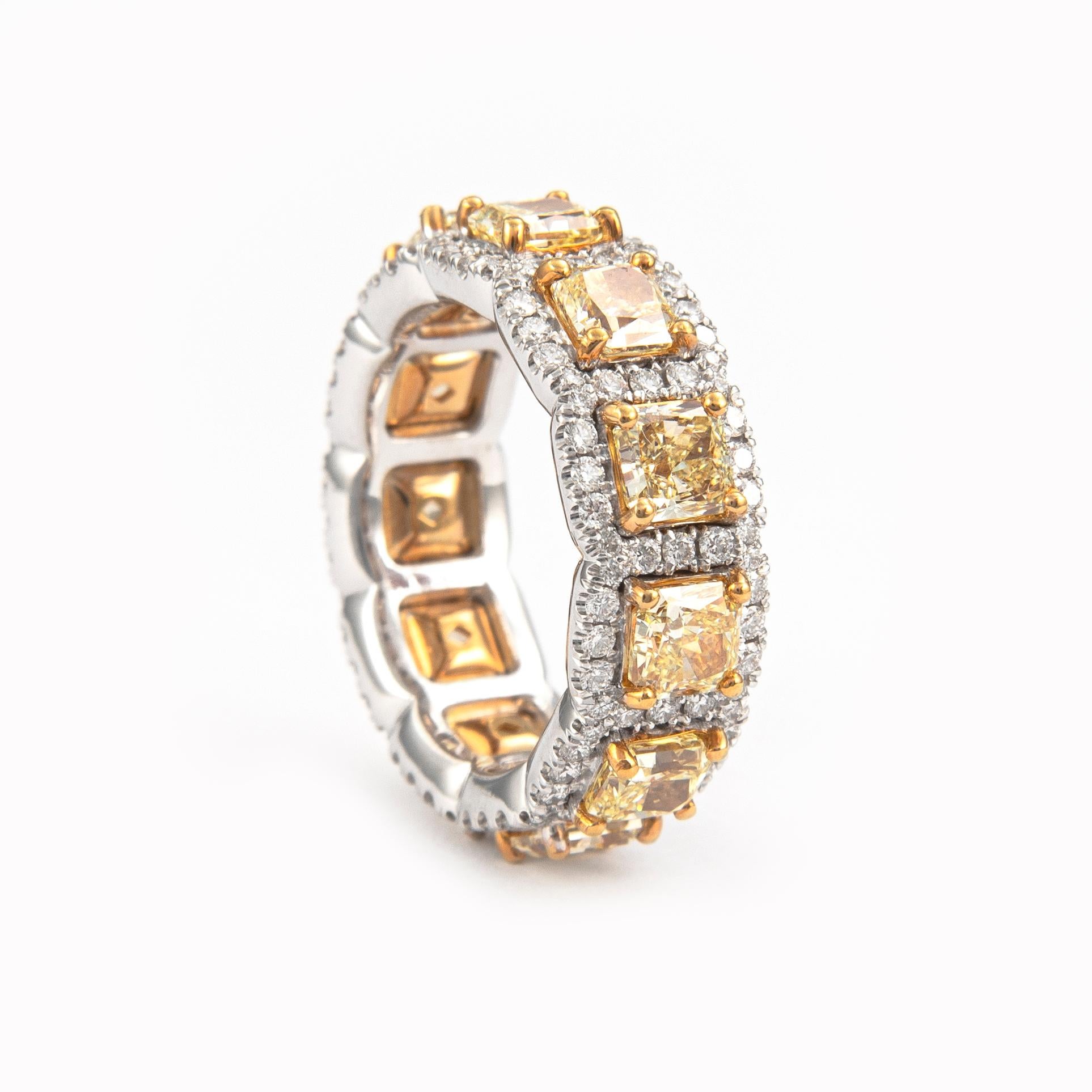 Timeless and unique diamond eternity band with halo. High jewelry Alexander Beverly Hills
14 radiant yellow diamonds, 5.35 carats total (apx .48ct each), VS clarity. Complimented by 1.06ct of round brilliant diamonds, approximately G/H color and VS