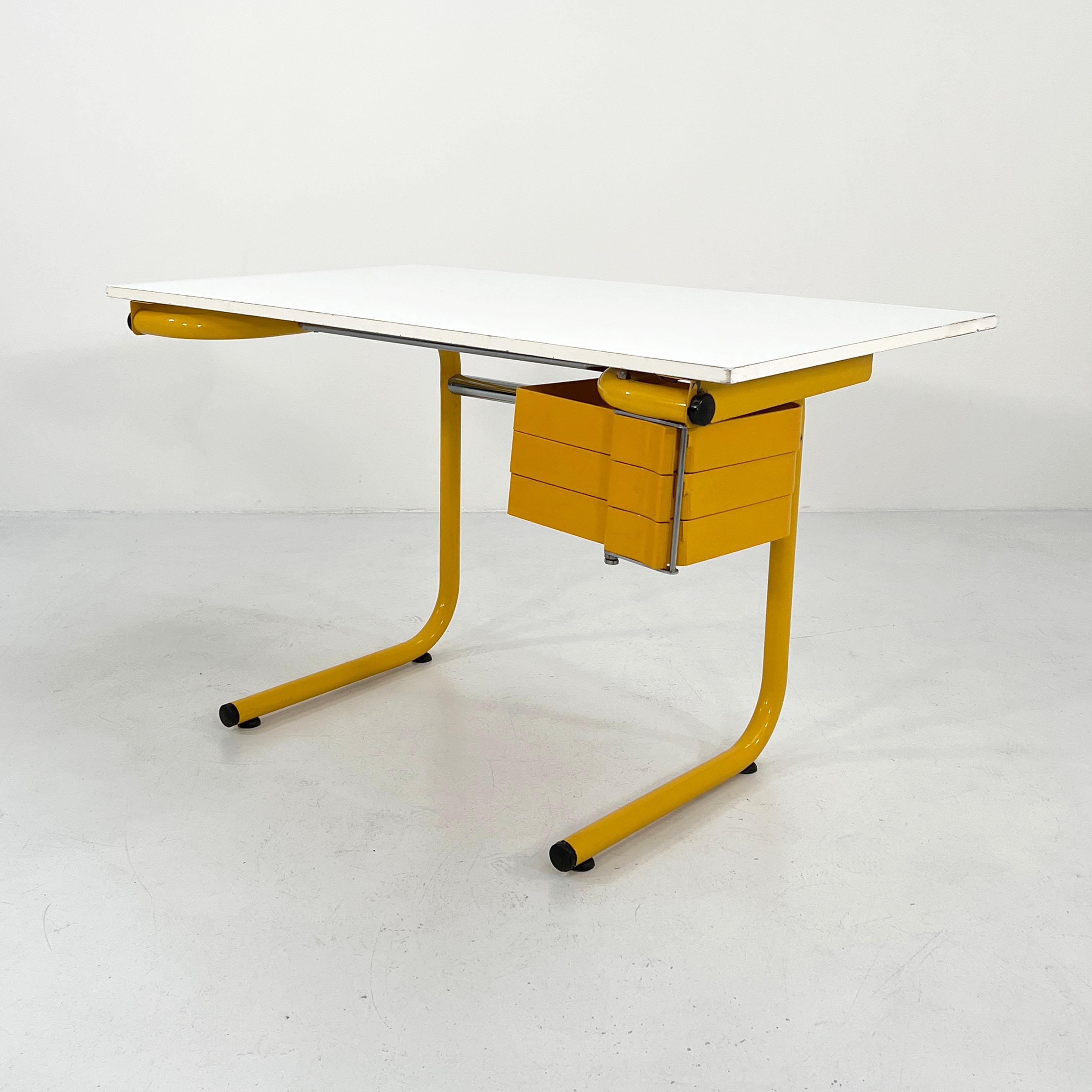 Designer - Joe Colombo 
Producer - Bieffeplast
Model - Drafting Table/Desk
Design Period - Seventies
Measurements - width 125 cm x depth 74 cm x height 75 cm.
Materials - laminated, metal, plastic.
Color - yellow, white 

Condition - Good