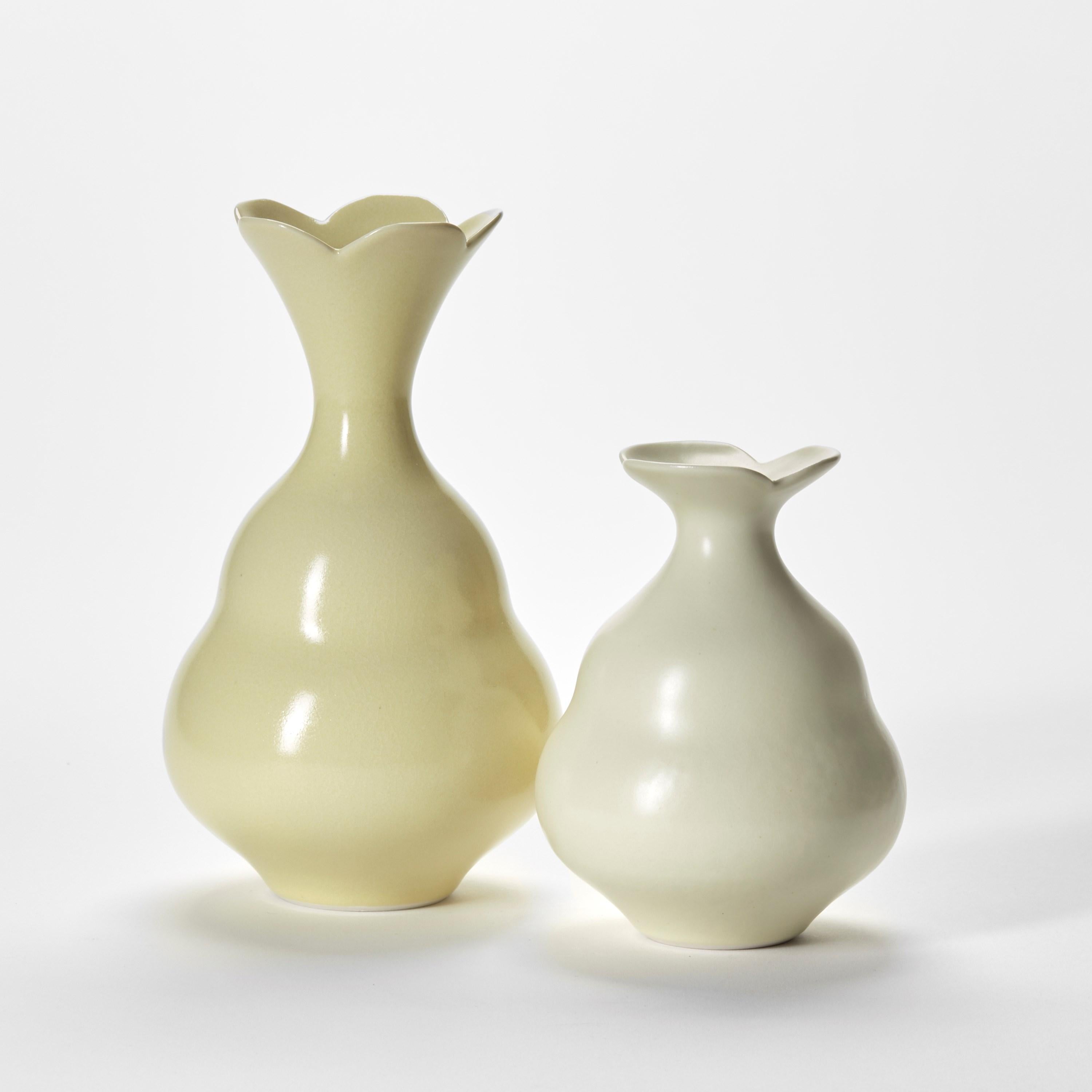 'Yellow Duo’ is a unique pair of porcelain sculptural vessels by the British artist, Vivienne Foley.

Left to right in the first image;

Strong Yellow Gourd  H 22 cm W 13 cm D 13 cm
Primrose Yellow Gourd  H 15 cm W 11.5 cm D 11.5 cm 

Vivienne Foley