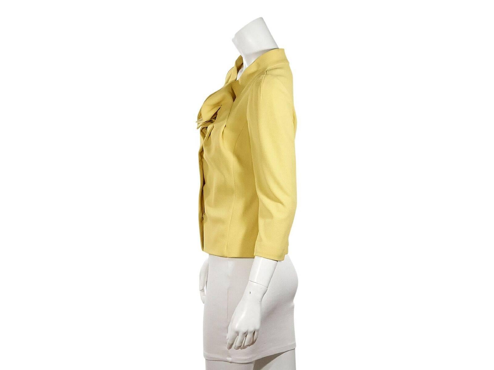 Product details:  Yellow textured jacket by Fendi.  Pleated ruffle collar.  Three-quarter sleeves.  Concealed front closure.  38