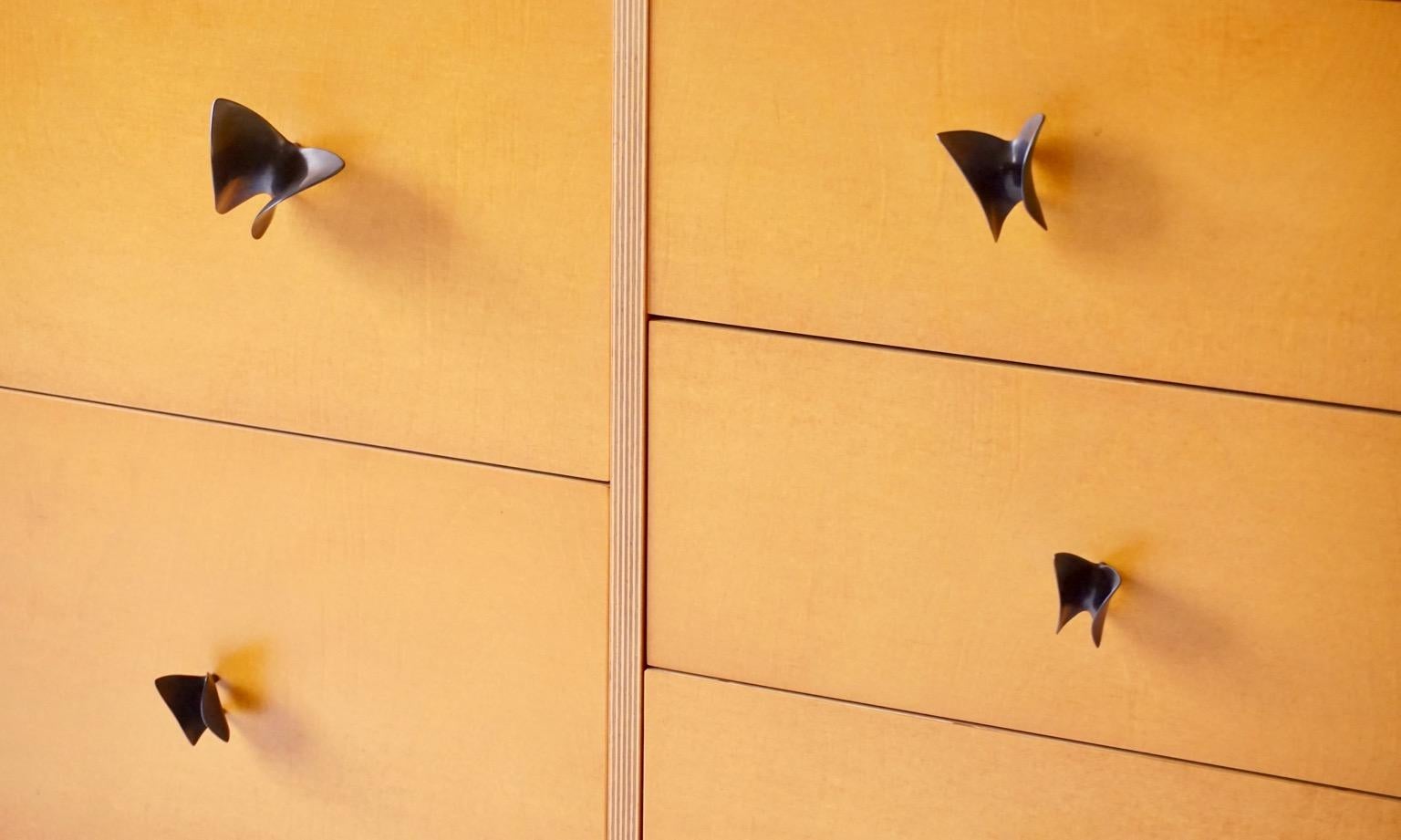 The butterfly cabinet is one of a group of pieces Lehrecke designed while working with the E.R.Butler hardware company in 2009. Most of the pieces involved knobs of his own design for the company, but in this piece we used the Ted Muehling designed