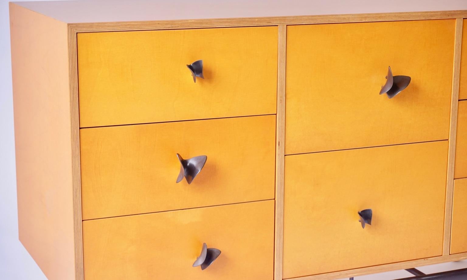 American Yellow Finn Ply Cabinet with Bronze Base and Bronze Butterfly Pulls