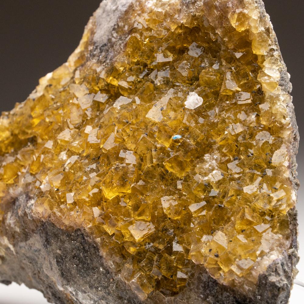 From Moscona Mine, Villabona District, Asturias, SpainAesthetic penetrating cubic formation of transparent to translucent golden yellow fluorite crystals on matrix. The unique crystal structure makes this a beautiful and rare addition to any