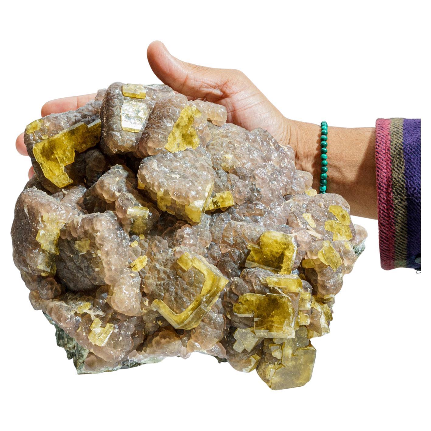 From Moscona Mine, Villabona District, Asturias, Spain.

Very aesthetic cluster of yellow crystals of cubic fluorite with a colorless calcite crystal perched on the top edge and drusy quartz overgrowth.

 

