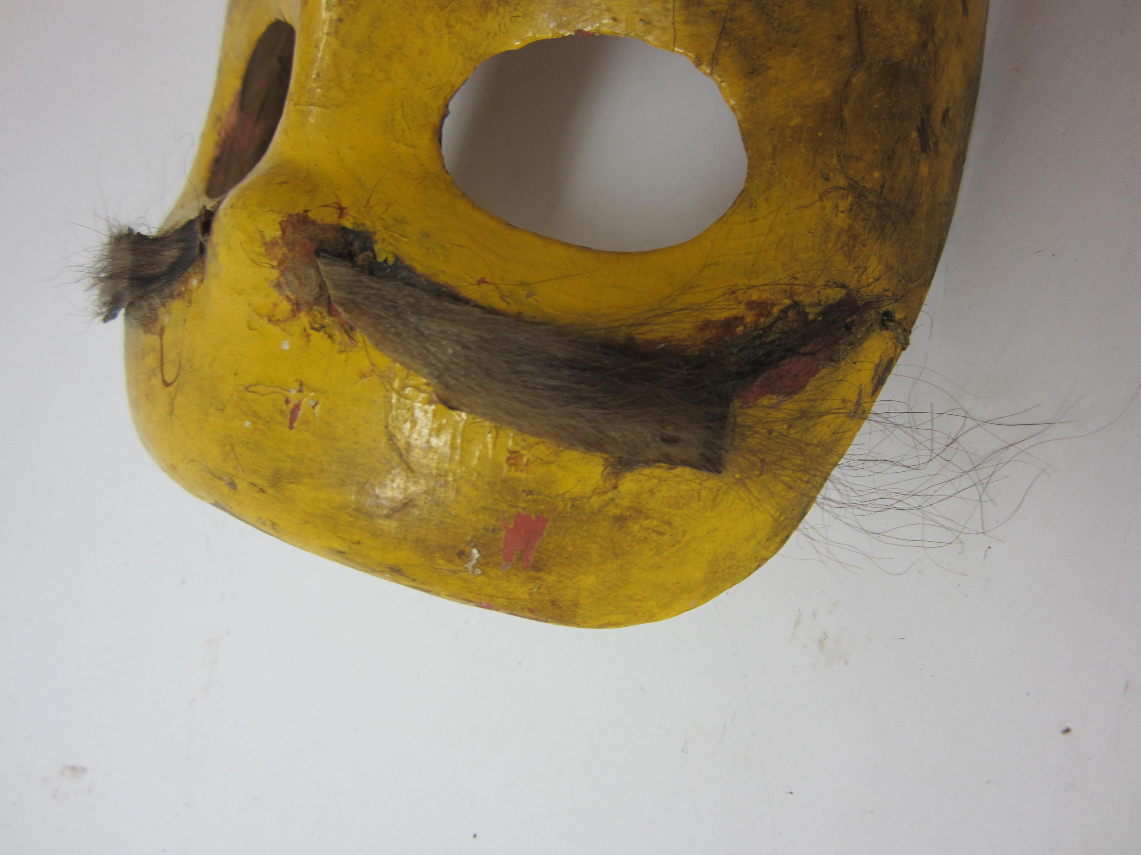 Yellow oriental mask.