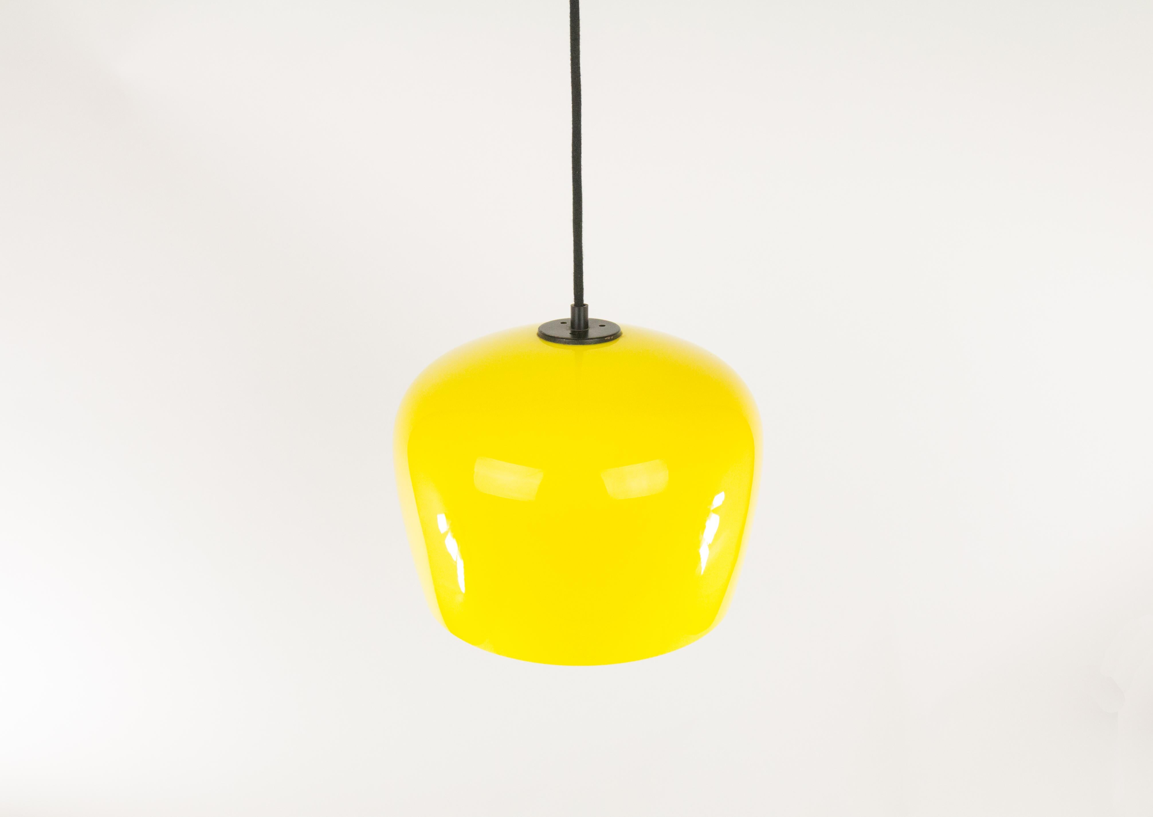 Striking yellow pendant by Alessandro Pianon for famous Venetian glassmaker Vistosi. It was designed in the 1960s.

The lamp was produced in three different colors: grey, orange and yellow. The glass is subtle and still in beautiful condition. The