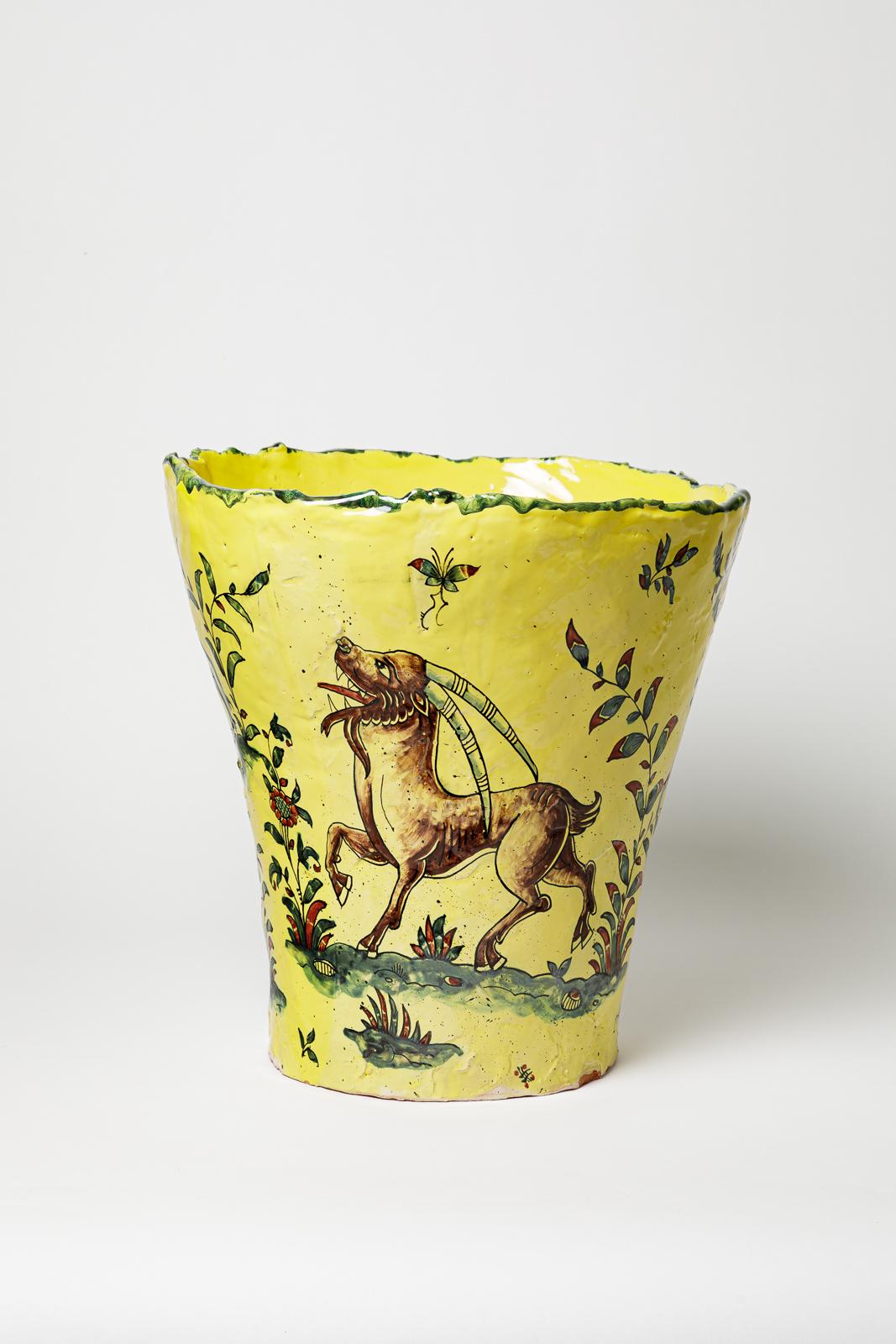 Yellow glazed earthenware vase, decorated with fantastical animals by Jérôme Galvin. 
Artist’s signature at the base «J.Galvin Moustiers». 2025. Unique piece.
H: 9.5 × 12.2 × 11.8 inches.
