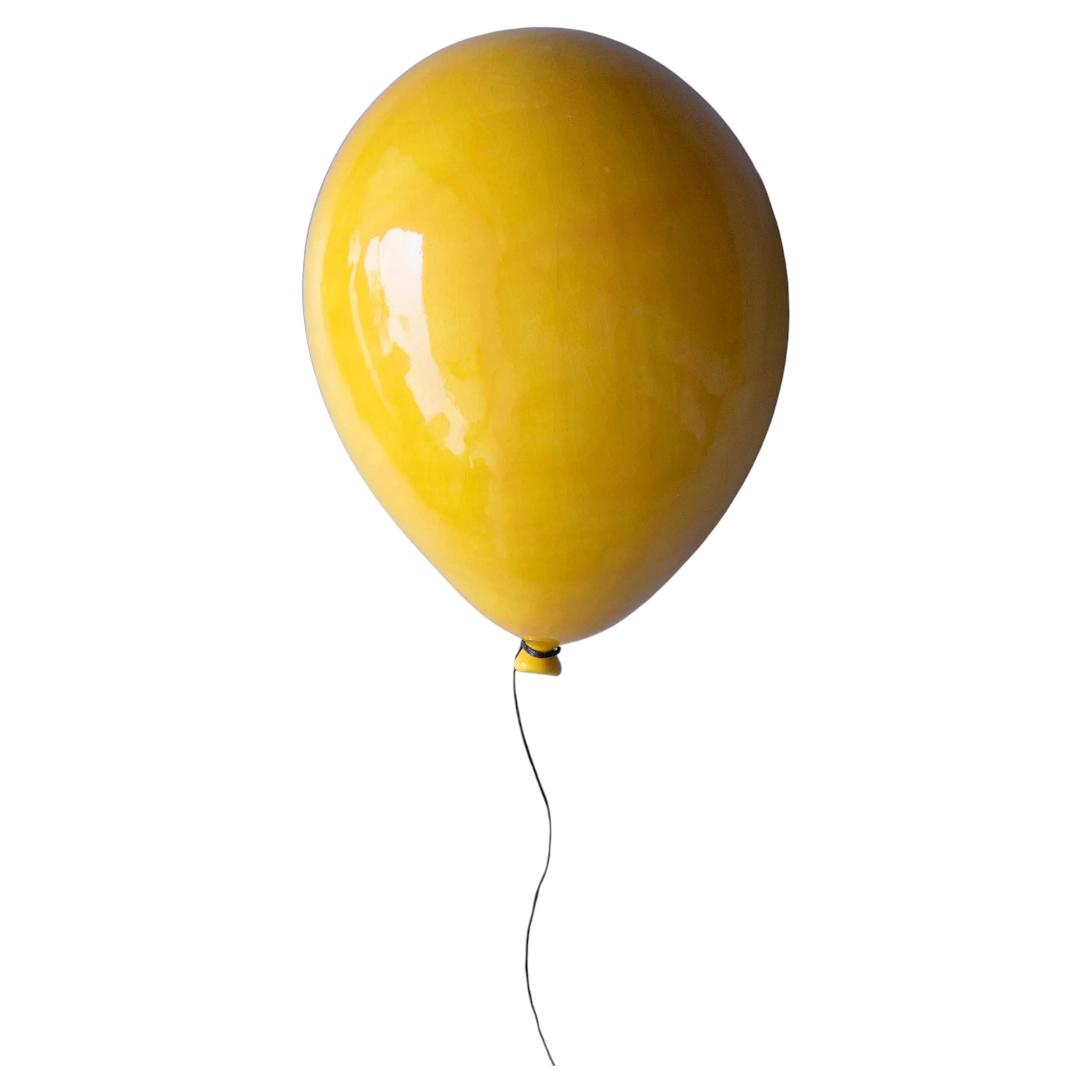 Yellow glossy ceramic balloon sculpture handmade for wall, ceiling installation