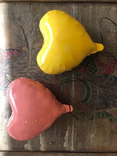 Yellow glossy ceramic heart balloon sculpture handmade for wall installation