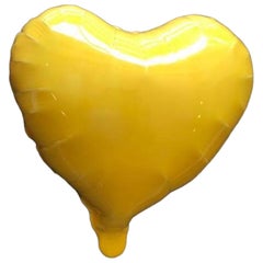 Yellow glossy ceramic heart balloon sculpture handmade for wall installation