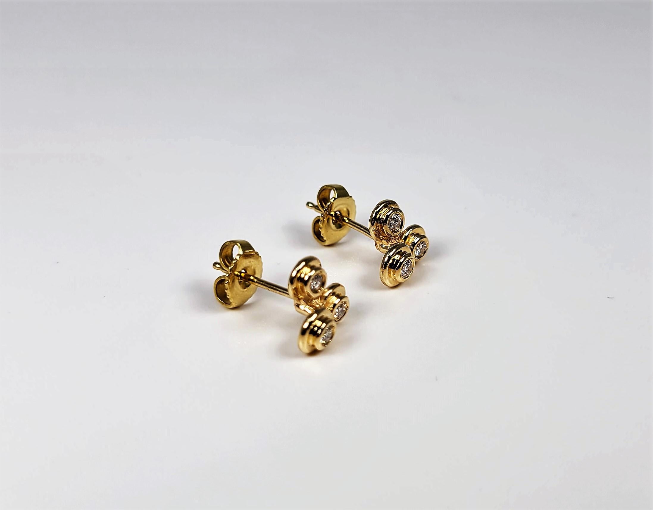 Precious little bubbles of diamonds on your ear, in 14 karat yellow gold!