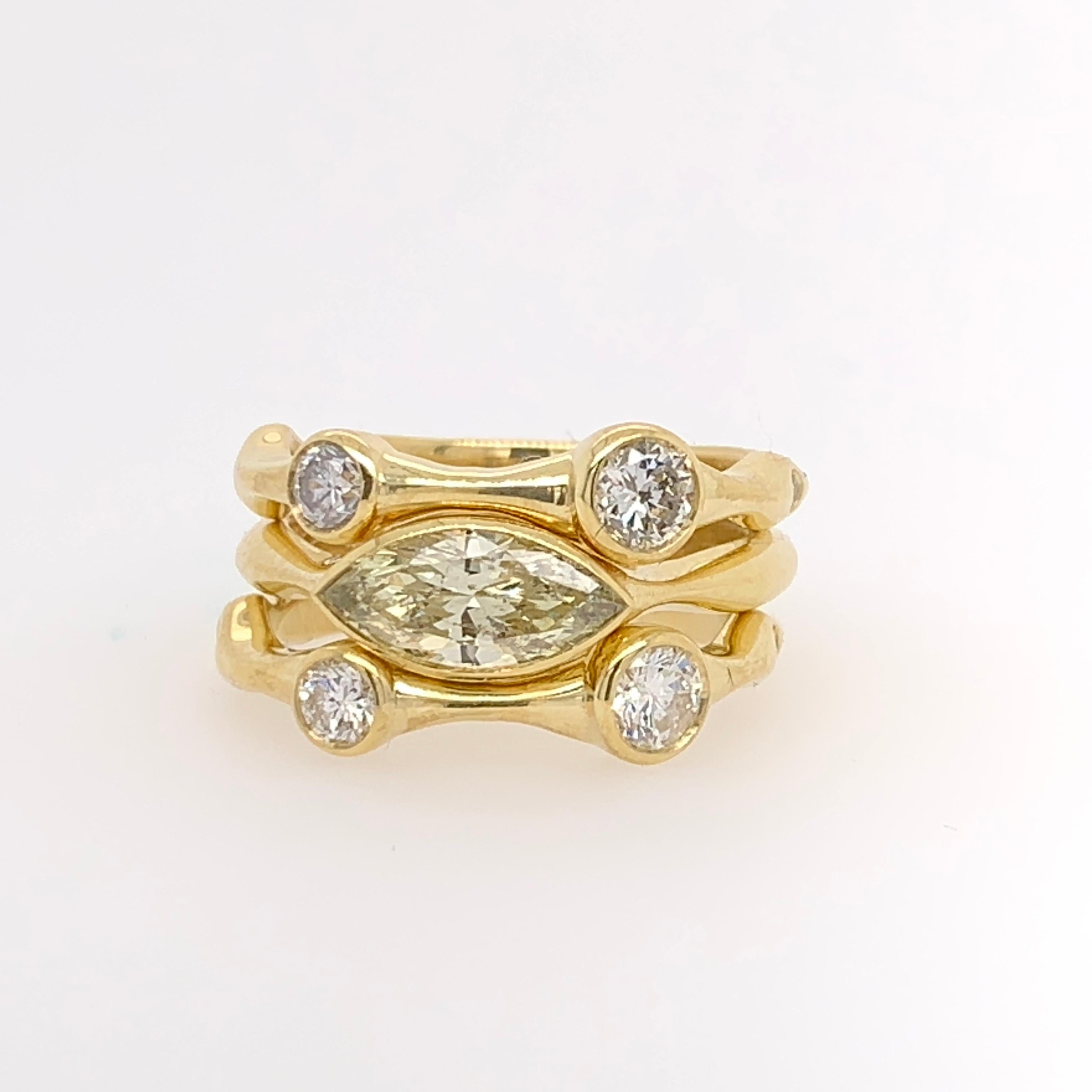 Stunning 18K Yellow Gold Natural Diamond Cocktail Stack Ring Set. The rings are size 5.25 and weigh 10.02 grams.

The center ring is set with a natural light yellow marquise diamond weighing 0.75cts (10.2x4.6x2.7mm). The clarity is approximately SI2