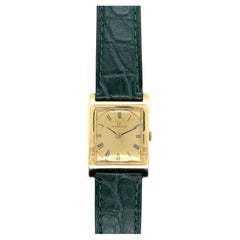 Montres Universal Geneve en or jaune 18 carats et cuir vert