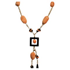 Yellow Gold 18 Kt. Pendant necklace and earrings with Onyx and Deep-Sea Corals