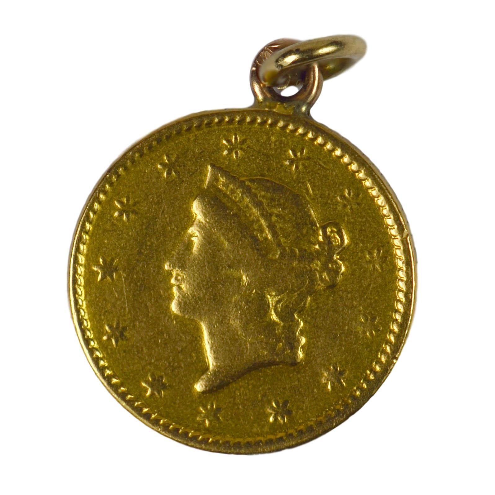 A 24 karat yellow gold 1849 one dollar coin converted to a charm pendant. This coin is the smallest made in US history, and was precipitated by the gold rush. Of numismatic interest, this rare coin has been quality graded as VF.

Known as the 