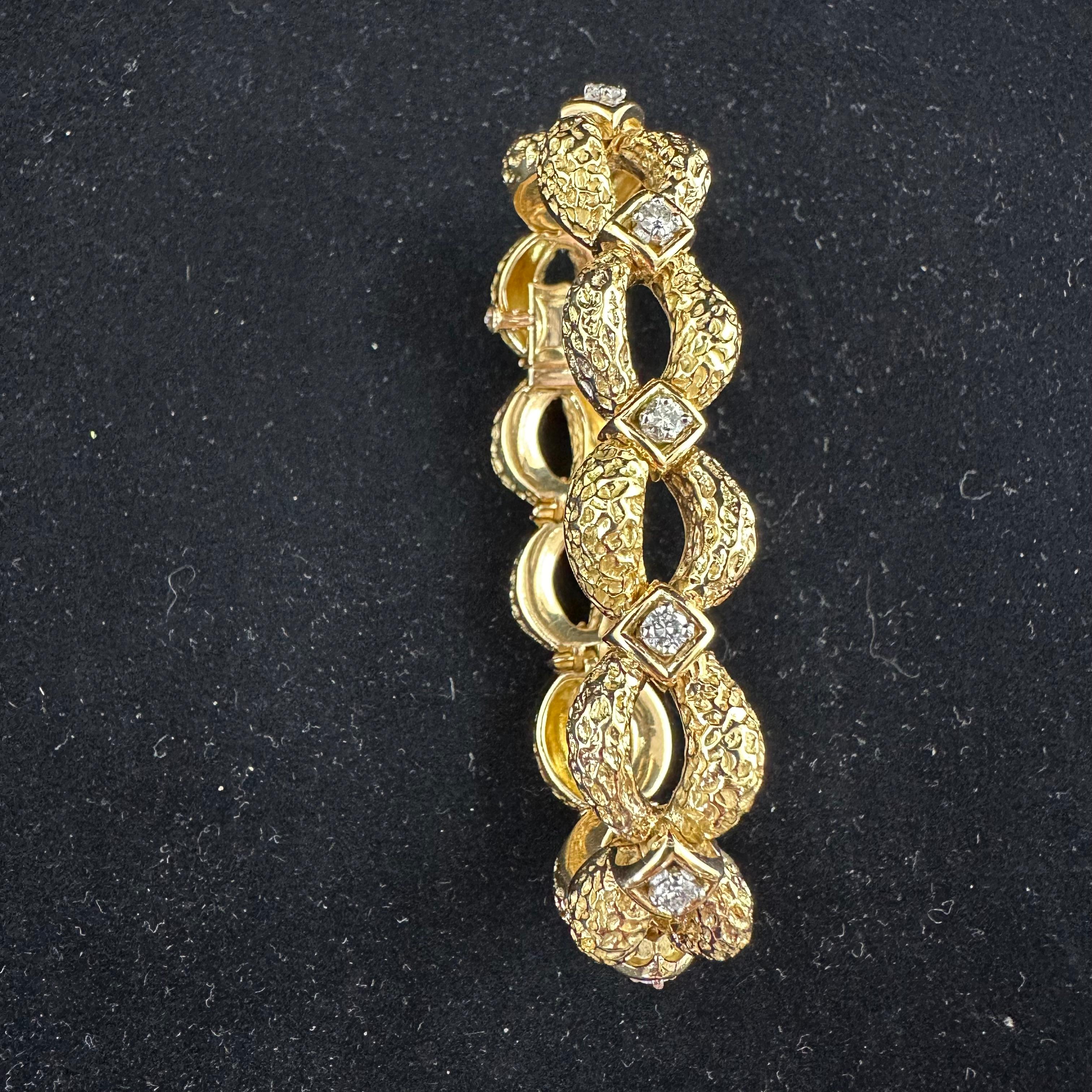 1960's Yellow Gold Round Diamond Bracelet 
Hallmarked #2846
65 grams or 2.30 Oz 
Medium size 6.5 inches 
11 Round Diamonds G-H Color @ 1.65 cts tW
Diamond Button Clasp, Press and open with Pin pusher safety Clasp. Beautiful Sections of Textured