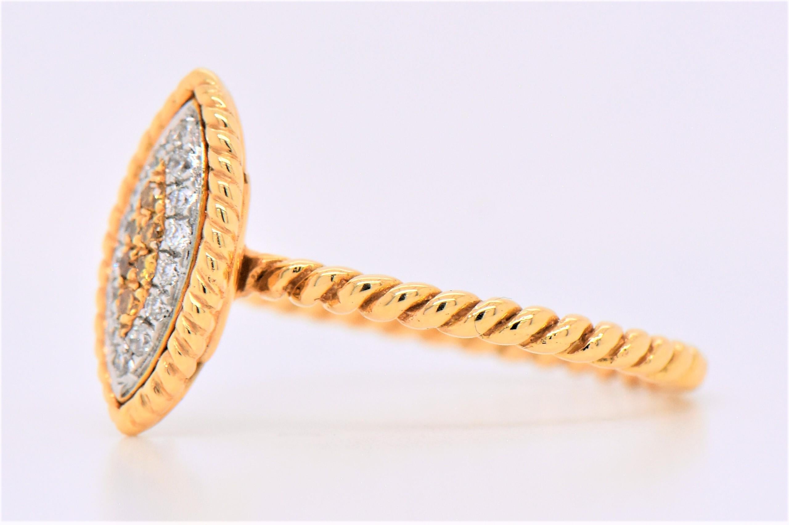 Dazzling diamond and Natural Fancy Yellow Diamonds snake eye set on a gold band. Diamonds, 0.10 total carat weight, clarity: VS Diamond Color: G. Fancy Yellow Diamonds 0.04 total carat weight 18K yellow gold.

Diamond Breakdown:
16 Round White