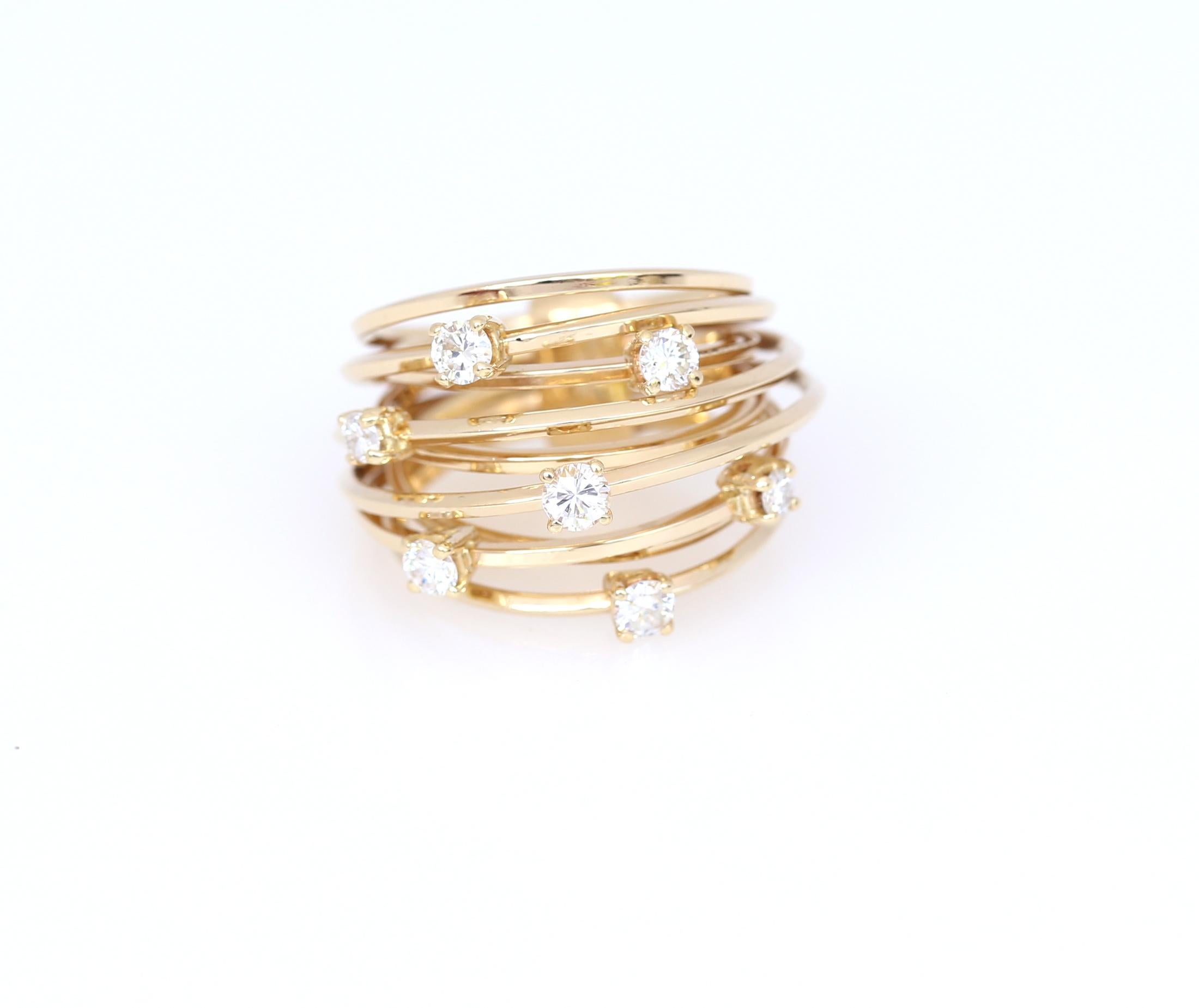 Modern 2010 fine Yellow 18K Gold ring.
Diamonds total weight: 0.80Ct. Delicate and attractive ring consists of 6 separate rings connected in the back. It creates an airy impression. Diamonds are of fine quality, shining brightly on the