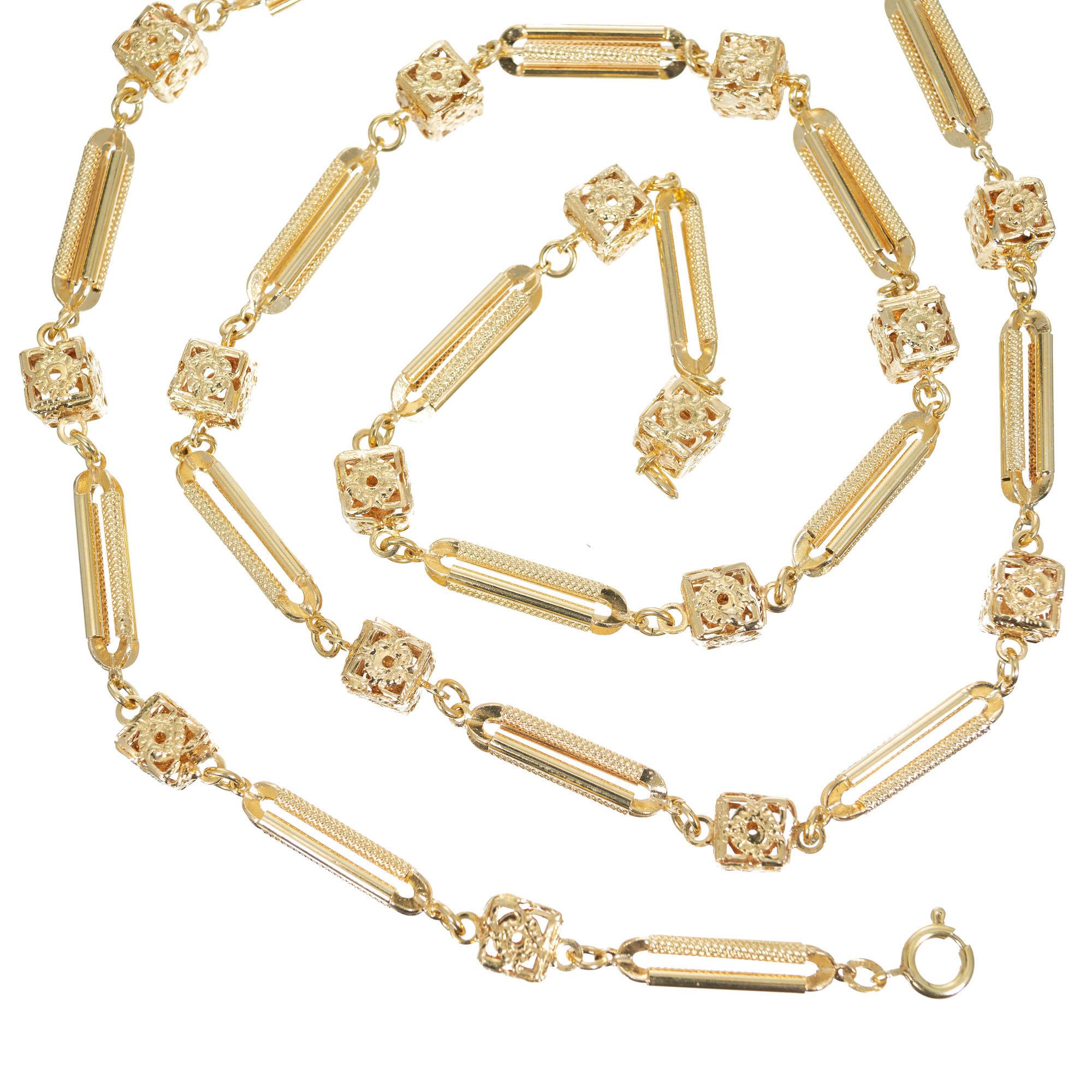 1940’s custom link 32 Inch box and tube Chain Necklace.

14k yellow gold 
Stamped: 14k
36.1 grams
Chain: 32 Inches
Width: 8mm
Thickness/depth: 5.7mm
Bars: 22 x 5mm
Cube: 8mm x 8mm
