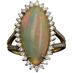 Yellow Gold 8.5 Carat Ethiopian Opal with Diamond Halo Ring