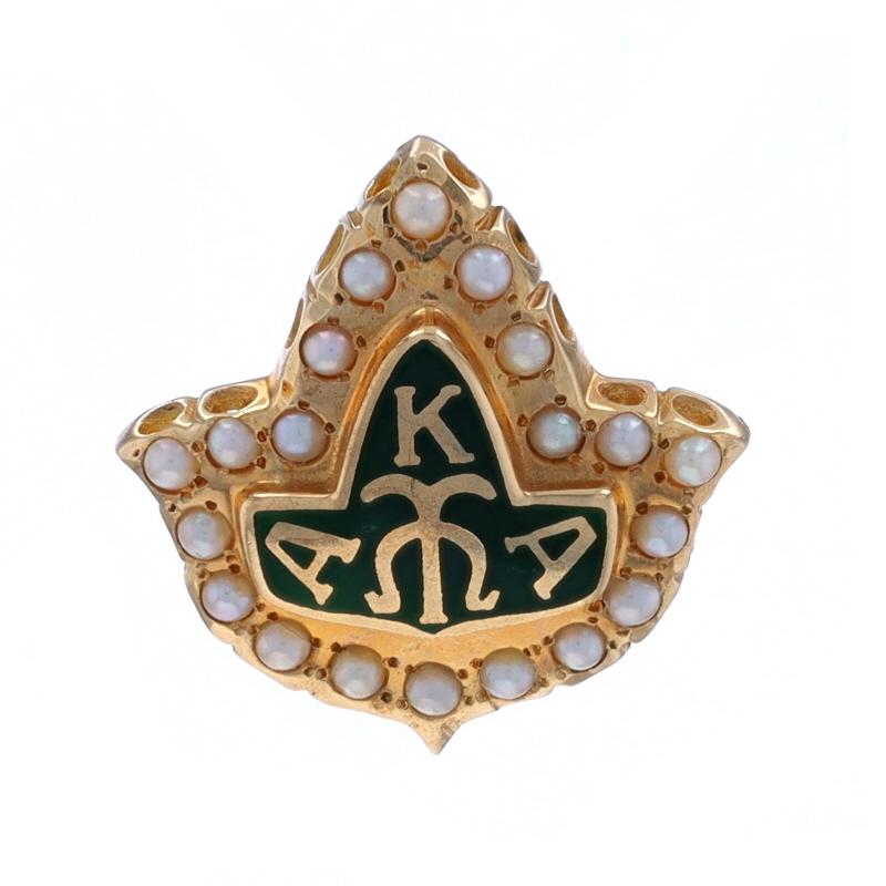 Sorority: Alpha Kappa Alpha
Sorority Founding Date: 1908

Metal Content: 10k Yellow Gold

Stone Information
Natural Seed Pearls

Material Information
Enamel
Color: Green

Style: Badge
Fastening Type: Hinged Pin and Whale Tail Bullet