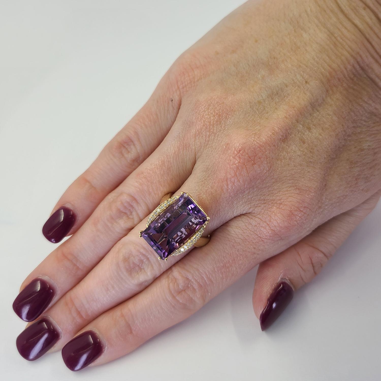 14 Karat Yellow Gold Cocktail Ring Featuring A 10 Carat Baguette Cut Amethyst Accented By 22 Single Cut Diamonds of SI Clarity and G/H Color Totaling 0.11 Carats. Detailed Side Gallery. Finger Size 6.5; Purchase Includes One Sizing Service. Finished