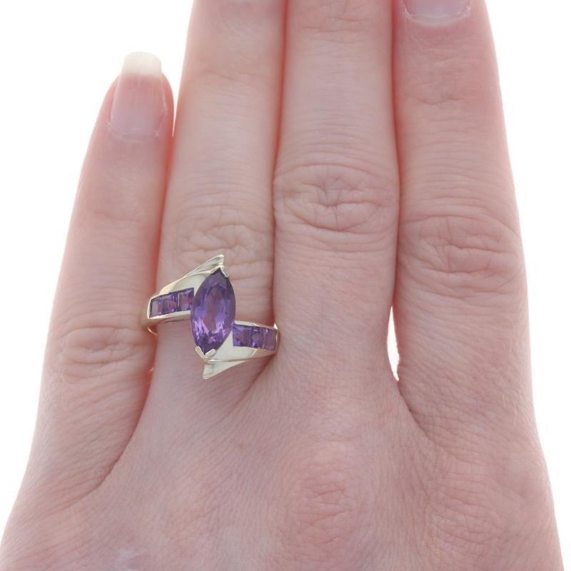 Size: 7 1/2

Metal Content: 10k Yellow Gold

Stone Information

Natural Amethysts
Carat(s): 2.25ctw
Cut: Marquise & Square
Color: Purple

Total Carats: 2.25ctw

Style: Solitaire with Accents Bypass

Measurements

Face Height (north to south): 11/16