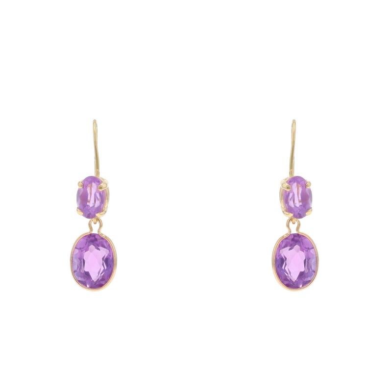 Metal Content: 14k Yellow Gold

Stone Information

Natural Amethysts
Carat(s): 3.40ctw
Cut: Oval
Color: Purple

Total Carats: 3.40ctw

Style: Dangle
Fastening Type: Fishhook Closures with Safety Hooks

Measurements

Tall: 31/32