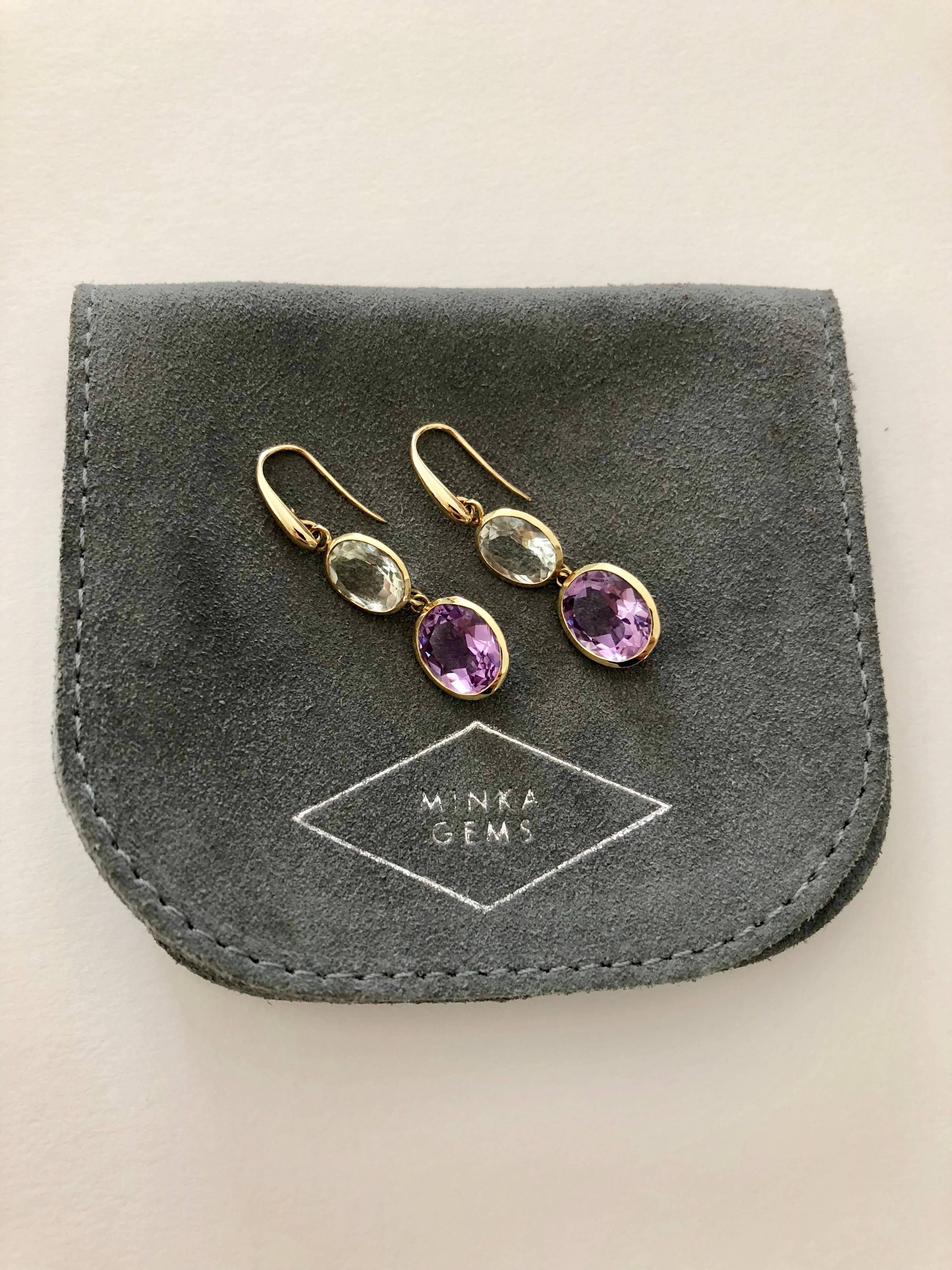 Indian Ocean Earrings - Stylish and elegant this stunning pair of earrings is made from 18kt yellow gold and semi precious stones. Designed and carefully hand crafted in the UK.

18 karat yellow gold
6.4 grams 
Lilac Amethyst & Prasiolite gem