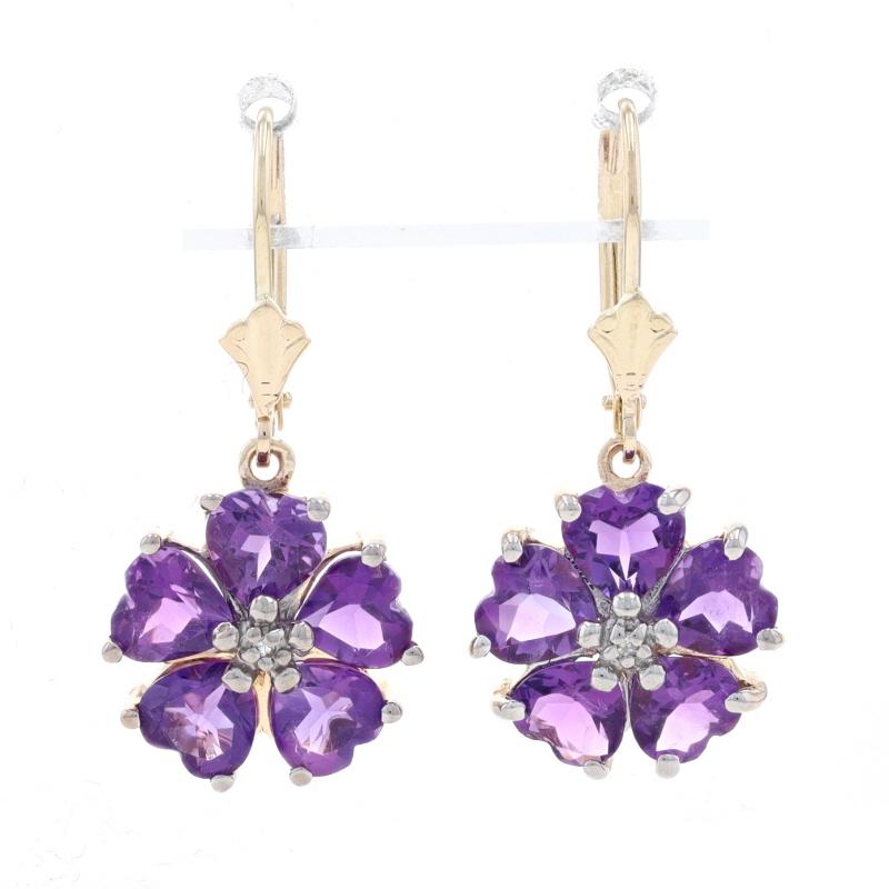 Metal Content: 14k Yellow Gold & 14k White Gold

Stone Information
Genuine Amethysts
Total Carats: 4.00ctw
Cut: Heart
Color: Purple

Natural Diamonds
(two small accents)
Cut: Single

Style: Dangle 
Fastening Type: Leverback Closures
Theme: Flower