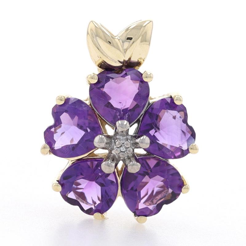 Metal Content: 14k Yellow Gold & 14k White Gold

Stone Information
Genuine Amethysts
Total Carats: 3.50ctw
Cut: Heart
Color: Purple

Natural Diamond
(one small accent)

Theme: Flower Blossom

Measurements
Tall (from stationary bail): 13/16