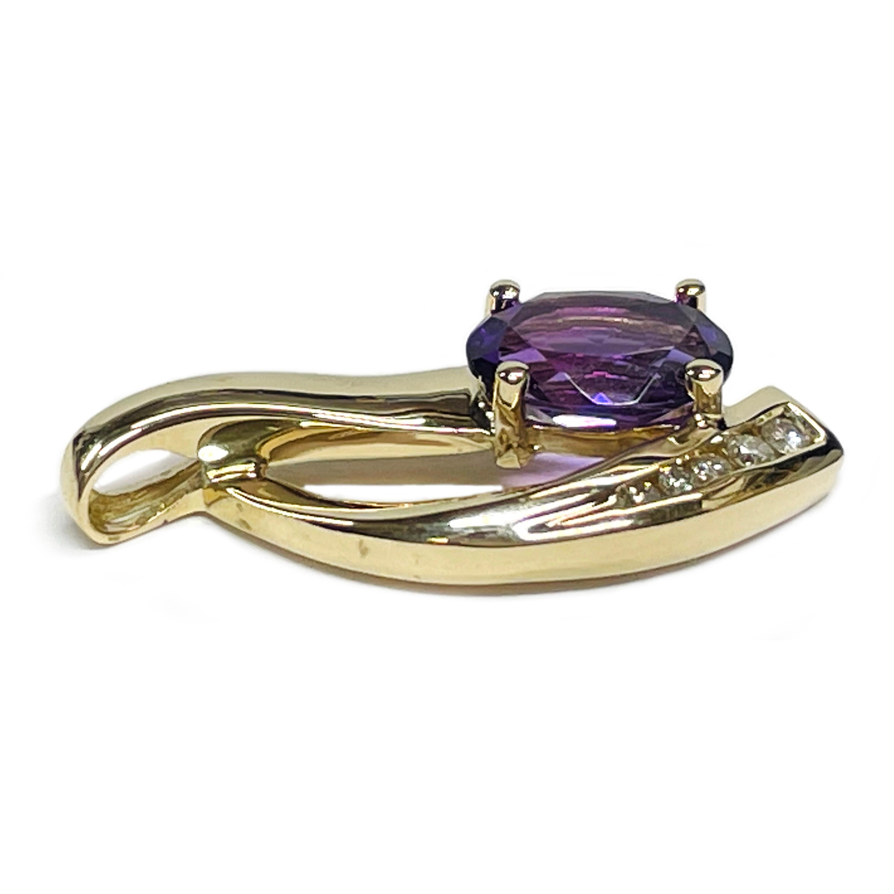 14 Karat Yellow Gold Amethyst Diamond Pendant. The pendant features two curved gold swooshes with one having an oval prong-set 9 x 7mm Amethyst and the other having five round graduate channel-set diamonds. The total carat weight of the diamonds is