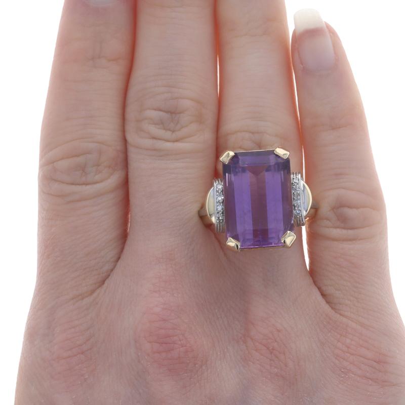 Size: 8 3/4
Sizing Fee: Up 3 sizes for $40 or Down 1 1/2 sizes for $30

Era: Retro
Date: 1940s - 1950s

Metal Content: 14k Yellow Gold & 14k White Gold

Stone Information
Natural Amethyst
Carat(s): 14.25ct
Cut: Emerald
Color: Purple

Natural