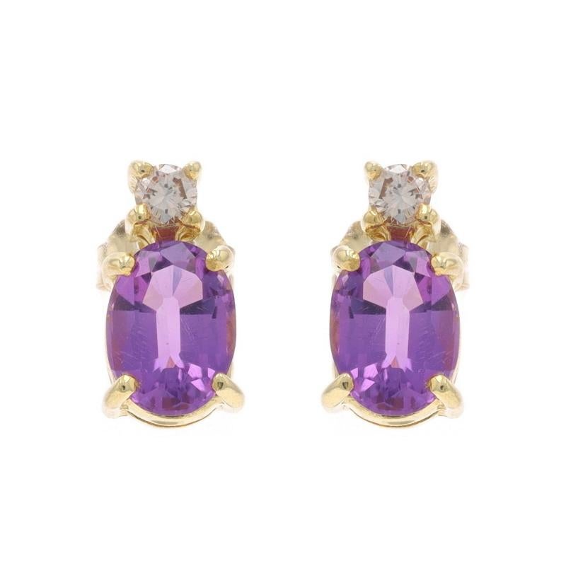 Metal Content: 14k Yellow Gold

Stone Information

Natural Amethysts
Carat(s): 1.70ctw
Cut: Oval
Color: Purple

Natural Diamonds
Carat(s): .12ctw
Cut: Round Brilliant
Color: Champagne Brown
Clarity: VS2 - SI1

Total Carats: 1.82ctw

Style: