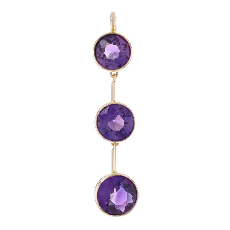 Metal Content: 14k Yellow Gold

Stone Information

Natural Amethysts
Carat(s): 4.40ctw
Cut: Round
Color: Purple

Total Carats: 4.40ctw

Pendant Style: Graduated Three-Stone Journey

Measurements

Tall (from stationary bail): 1 9/16