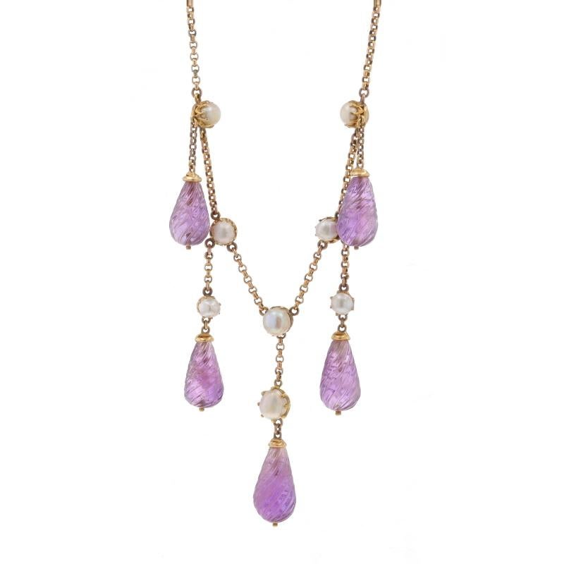 Era: Edwardian
Date: 1900s - 1910s

Metal Content: 15k Yellow Gold

Stone Information
Natural Amethysts
Cut: Carved
Color: Purple

Natural Pearls

Style: Dangle
Chain Style: Rolo
Necklace Style: Chain
Fastening Type: Spring Ring Clasp
Theme: