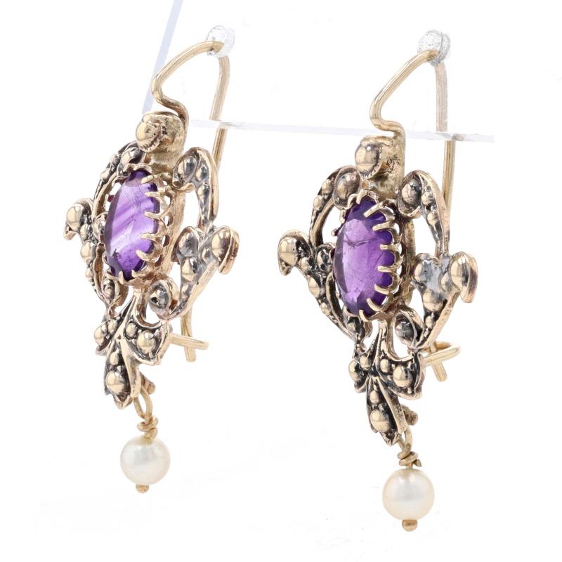 Design: Victorian-Inspired 

Metal Content: 14k Yellow Gold

Stone Information

Natural Amethysts
Carat(s): 2.50ctw
Cut: Oval
Color: Purple

 Cultured Pearls

Total Carats: 2.50ctw

Style: Drop 
Fastening Type: Fishhook Closures with Safety