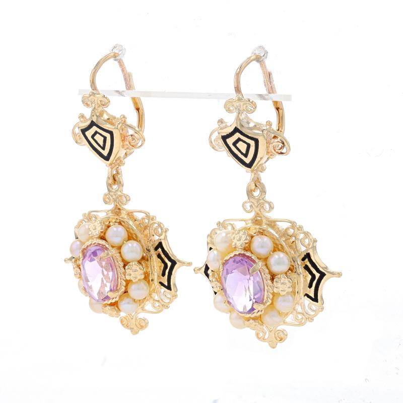 Era: Victorian Revival
Date: 1950s - 1960s

Metal Content: 14k Yellow Gold

Stone Information
Natural Amethysts
Carat(s): 2.50ctw
Cut: Oval
Color: Light Purple

Cultured Pearls
Color: Cream

Material Information
Enamel
Color: Black

Style: Halo