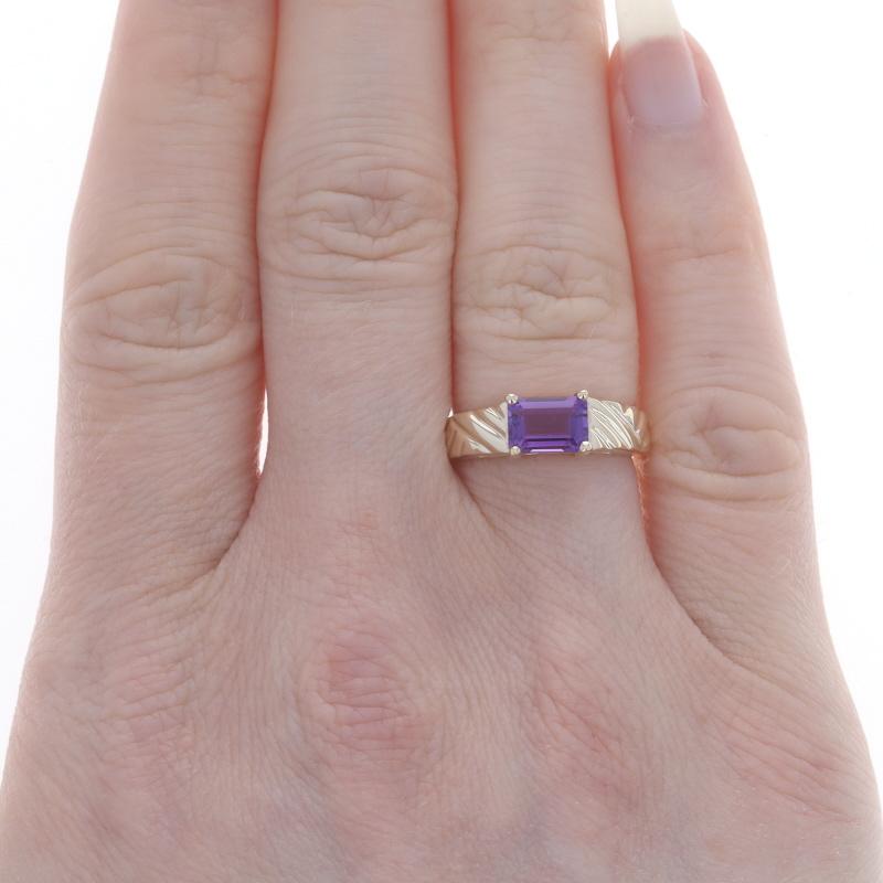 Size: 5
Sizing Fee: Up 2 sizes for $30 or Down 1 size for $20

Metal Content: 10k Yellow Gold

Stone Information

Natural Amethyst
Carat(s): .80ct
Cut: Emerald
Color: Purple

Total Carats: .80ct

Style: Solitaire Band
Features: East-West Set Stone