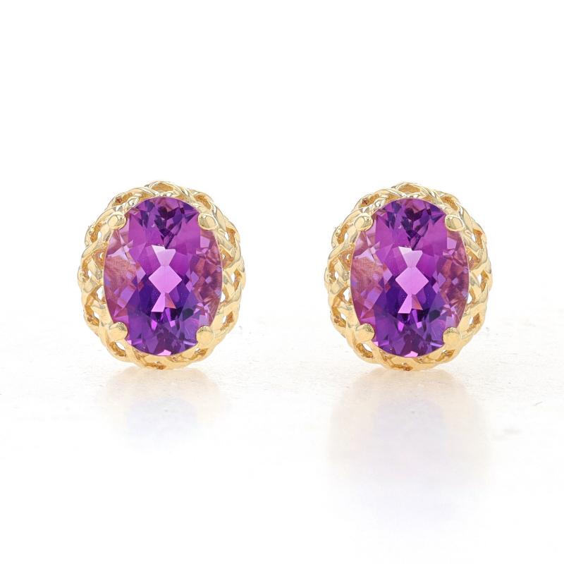Metal Content: 14k Yellow Gold

Stone Information
Natural Amethysts
Carat(s): 2.50ctw
Cut: Oval
Color: Purple

Total Carats: 2.50ctw

Style: Stud
Fastening Type: Butterfly Closures

Measurements
Tall: 13/32