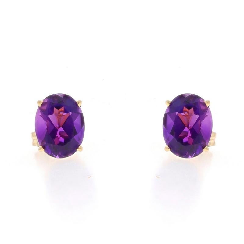 Metal Content: 14k Yellow Gold

Stone Information

Natural Amethysts
Carat(s): 3.50ctw
Cut: Oval
Color: Purple

Total Carats: 3.50ctw

Style: Stud
Fastening Type: Butterfly Closures

Measurements

Tall: 3/8