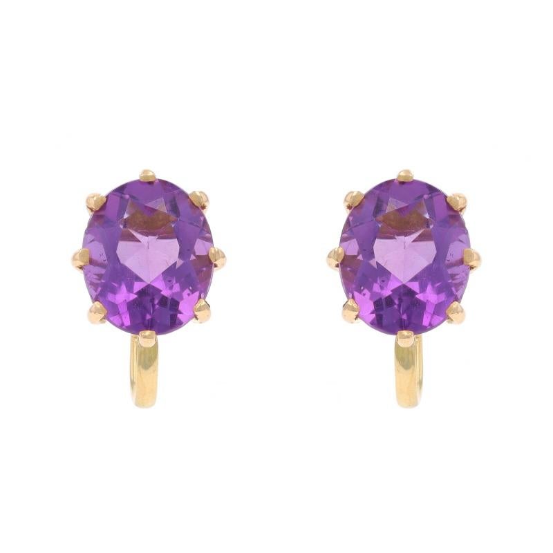 Era: Vintage

Metal Content: 14k Yellow Gold

Stone Information

Natural Amethysts
Carat(s): 5.78ctw
Cut: Oval
Color: Purple

Total Carats: 5.78ctw

Style: Stud
Fastening Type: Non-Pierced Screw-On Closures

Measurements

Tall: 5/8