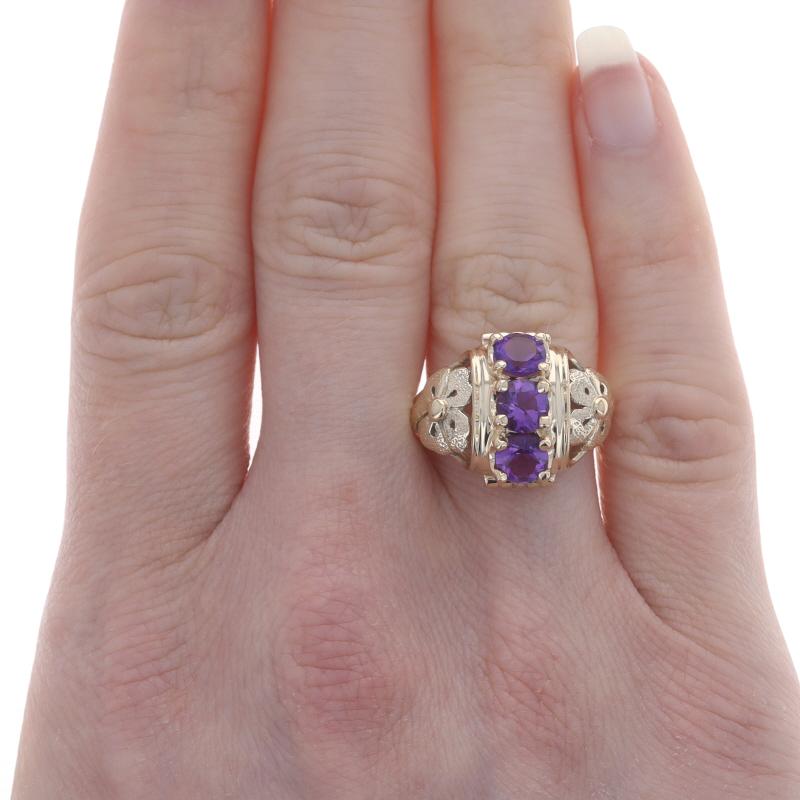 Size: 6 3/4
Sizing Fee: Up 4 sizes for $40 or Down 2 sizes for $30

Era: Vintage

Metal Content: 14k Yellow Gold

Stone Information
Natural Amethysts
Carat(s): 1.20ctw
Cut: Round
Color: Purple

Total Carats: 1.20ctw

Style: Three-Stone
Theme: