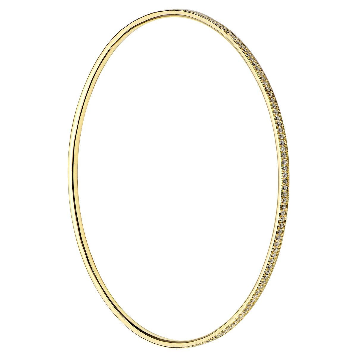 Bangles are so much fun to wear and add a special touch. This yellow gold and diamond bangle contains 6.5 grams of gold and 174 round VS2 , G color diamonds totaling 0.90 carats. It is 2.5 inches in diameter and looks amazing alone or stacked with